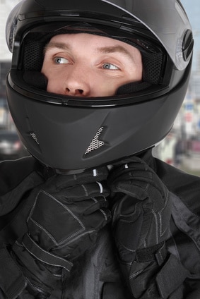 young motorcyclist man wearing helmet